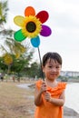 Asian Little Chinese Girl Playing Colorful Windmill Royalty Free Stock Photo