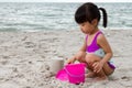 Asian Little Chinese Girl Playing Sand with Beach Toys Royalty Free Stock Photo