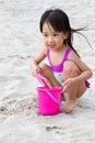 Asian Little Chinese Girl Playing Sand with Beach Toys Royalty Free Stock Photo