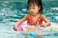 Asian Little Chinese Girl Playing in Swimming Pool Royalty Free Stock Photo