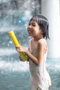 Asian Little Chinese Girl playing at water park Royalty Free Stock Photo