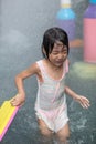 Asian Little Chinese Girl playing at water park Royalty Free Stock Photo