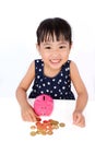 Asian Little Chinese Girl Saving Money in a Piggy Bank Royalty Free Stock Photo