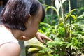 Asian Little Chinese Girl watching grass