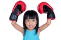 Asian Little Chinese Girl Wearing Boxing Glove With Fierce Expression