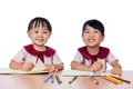 Asian Little Chinese girls drawing with color pencils