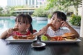 Asian Little Chinese Girls Eating Burger and Fried chicken Royalty Free Stock Photo