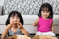 Asian Little Chinese Girls Eating Pizza