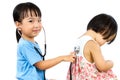 Asian Little Chinese Girls Playing as Doctor and Patient with St Royalty Free Stock Photo