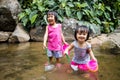 Asian Little Chinese Girls Playing in Creek