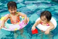 Asian Little Chinese Girls Playing in Swimming Pool Royalty Free Stock Photo