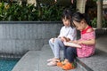 Asian Little Chinese Girls reading a book