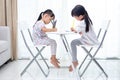 Asian Little Chinese sisters doing homework Royalty Free Stock Photo