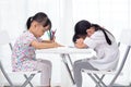 Asian Little Chinese sisters doing homework Royalty Free Stock Photo
