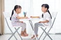 Asian Little Chinese sisters doing homework Royalty Free Stock Photo