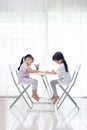 Asian Little Chinese sisters doing homework Royalty Free Stock Photo