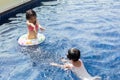 Asian Little Chinese Sisters Playing in Swimming Pool Royalty Free Stock Photo