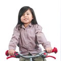 Asian Little Cute Girl Smiling and Riding on Bicycle Isolated on Royalty Free Stock Photo