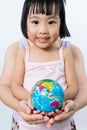 Asian Little Girl and Adult Holding a World Globe in Hands