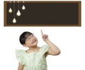 Asian little girl with blackboard with light bulb ideas on white background, Success, idea and innovation technology, Creative and Royalty Free Stock Photo