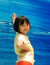 Asian little girl on blue background