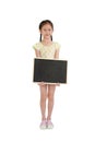 Asian little girl child holding blank blackboard isolated over white background. Full length Royalty Free Stock Photo