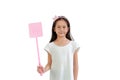 Asian little girl child holding pink flyswatter for attacking fly isolated on white background. Image with Clipping path Royalty Free Stock Photo