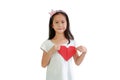 Asian little girl child holding red heart sign on chest against white background Royalty Free Stock Photo