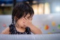 Asian little girl is crying. She wipes her tears. Stay in a rubberized swimming pool. Baby age 2-3 years old. Royalty Free Stock Photo