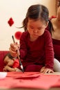 Asian little girl doing Chinese calligraphy with parent Royalty Free Stock Photo