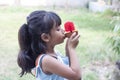 Asian little girl eating ice cream with deliciousness on summer.