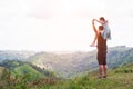 Asian little girl on his father shoulder standing on the top of mountain Royalty Free Stock Photo