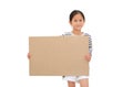 Asian little girl holding empty brown big board for media banner isolated on white background with copy space Royalty Free Stock Photo