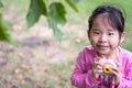 Asian little girl holding a plastic camera toy Royalty Free Stock Photo