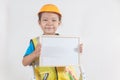 Asian Little Girl or Kids in Safety hat and Glowing shirt holding Blank empty whiteboard