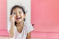 Asian little girl is laughing Royalty Free Stock Photo