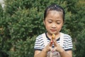 Asian little girl playing colour with hands