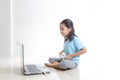 Asian little girl playing games with laptop computer and joystick controller Royalty Free Stock Photo