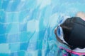 Asian little girl practice swimming for match in swimming pool. Little girl cheerful in this activity.She hard practice swimming b Royalty Free Stock Photo