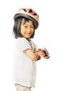 Asian little girl in protective roller gear on white background