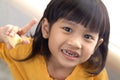 Asian little girl showing her open mouth full of caries teeth decay. Dental medicine and healthcare. caries from an early age Royalty Free Stock Photo