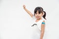 Asian little girl showing his arm after got vaccinated or inoculation, child immunization, covid delta vaccine concept