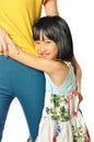 Asian little girl smilling and hugging mother's waist Royalty Free Stock Photo