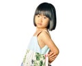 Asian little girl stands turning around Royalty Free Stock Photo