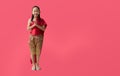 Asian little girl in Thai national costumes with welcome gesture of hands of Thailand