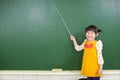 Asian little girl using a baton to point