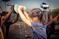 Asian little girl washing car Royalty Free Stock Photo