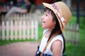 Asian little girl watching his activity ahead and laughing Royalty Free Stock Photo