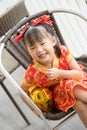 Asian little girl wearing red traditional Chinese suit