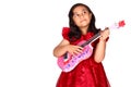 Asian little girl on white background isolated (6 year old) was playing the ukulele Royalty Free Stock Photo